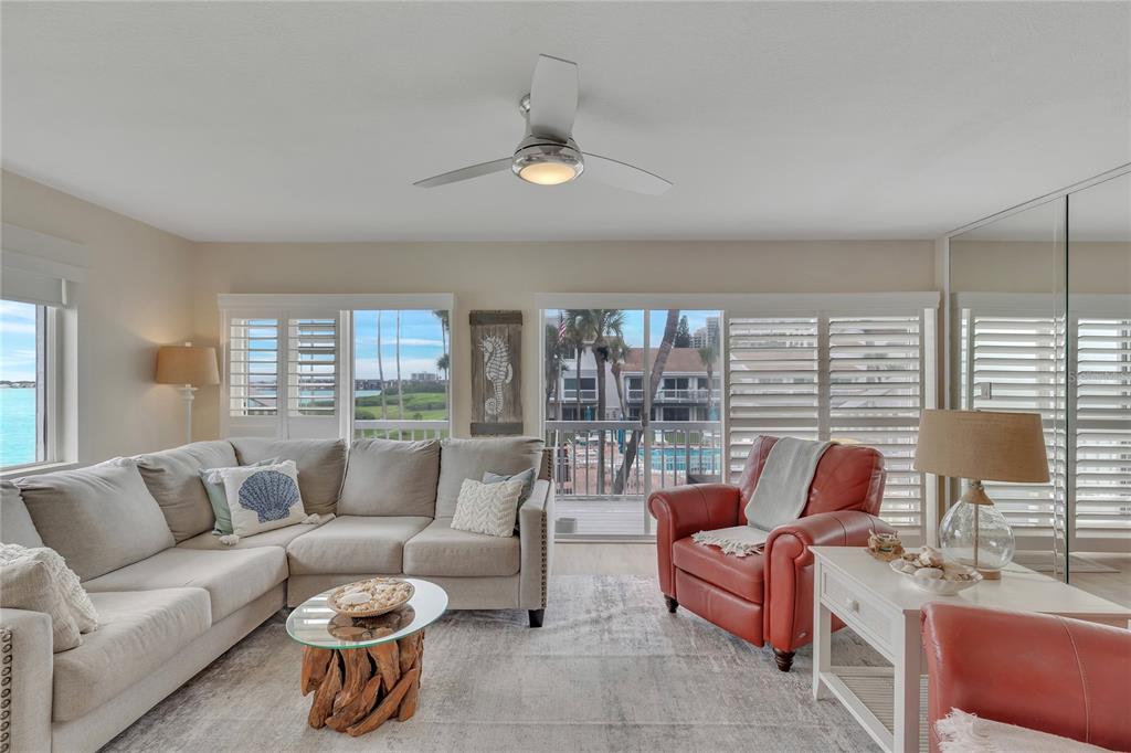 Undisclosed Address Clearwater, FL 33767 - Photo 10 of 39 a living room with furniture and a large window