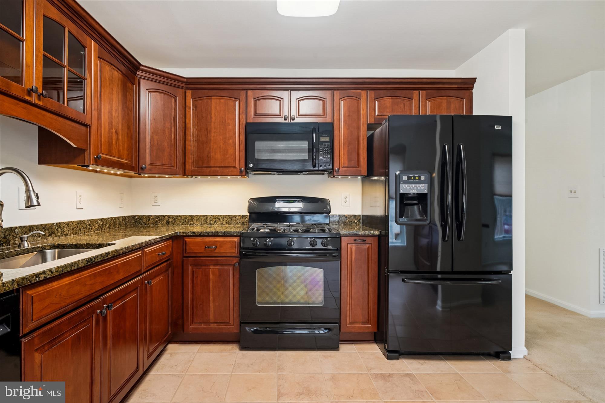 524 Coover Road Annapolis, MD 21401 - Photo 18 of 67 a kitchen with stainless steel appliances granite countertop a refrigerator stove and sink