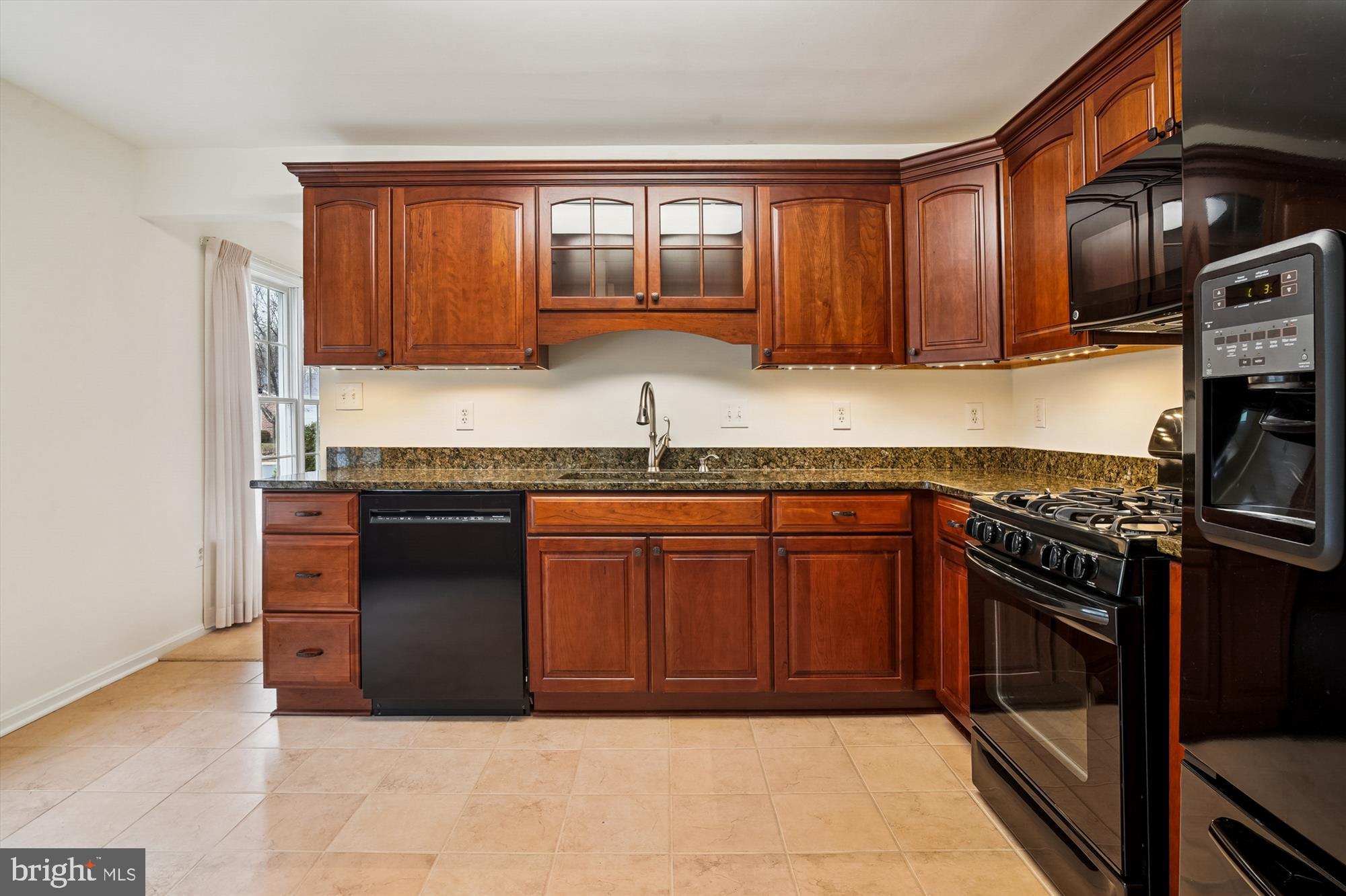 524 Coover Road Annapolis, MD 21401 - Photo 20 of 67 a kitchen with granite countertop stainless steel appliances and wooden cabinets