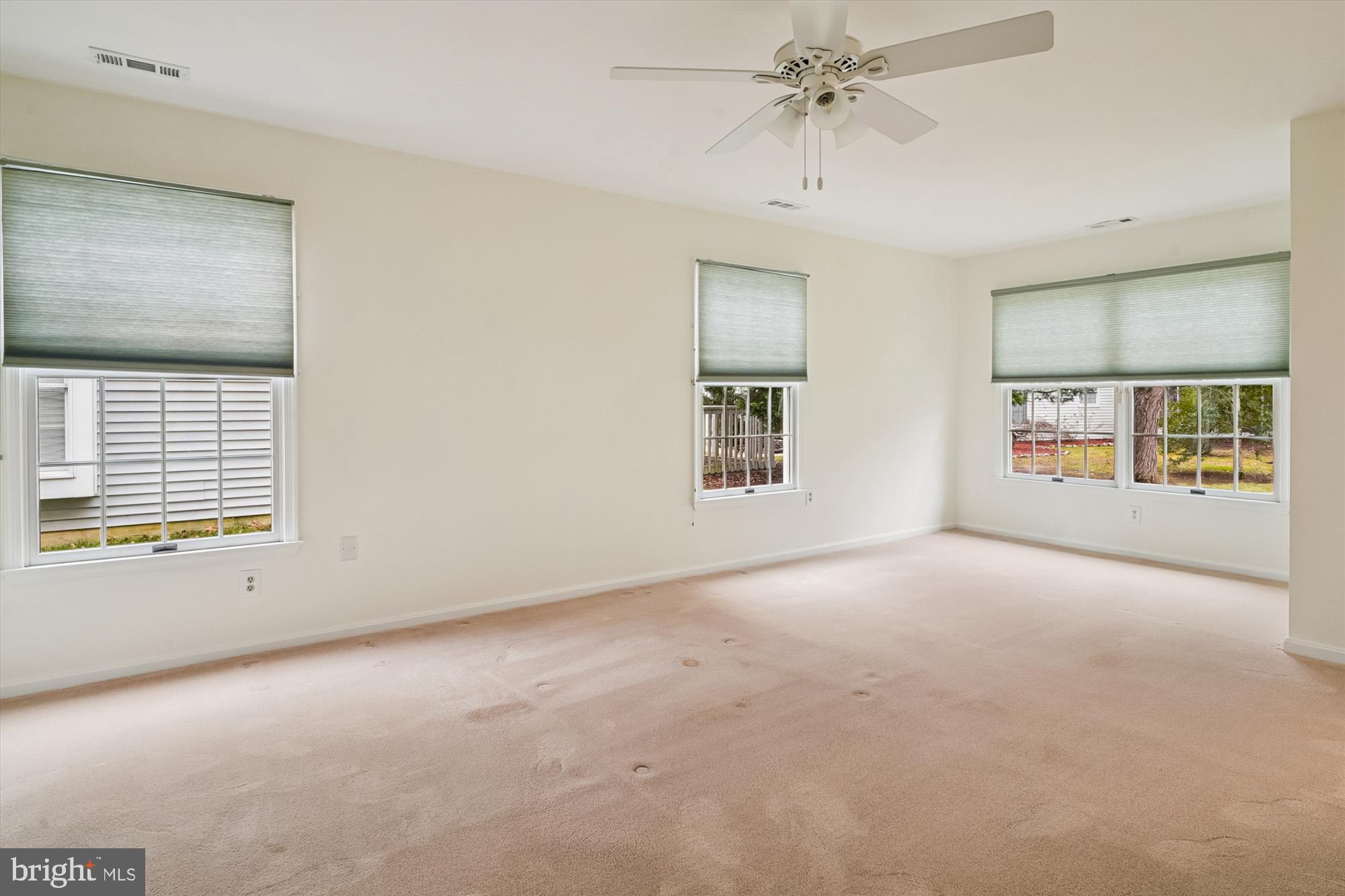 524 Coover Road Annapolis, MD 21401 - Photo 28 of 67 an empty room with windows and chandelier fan