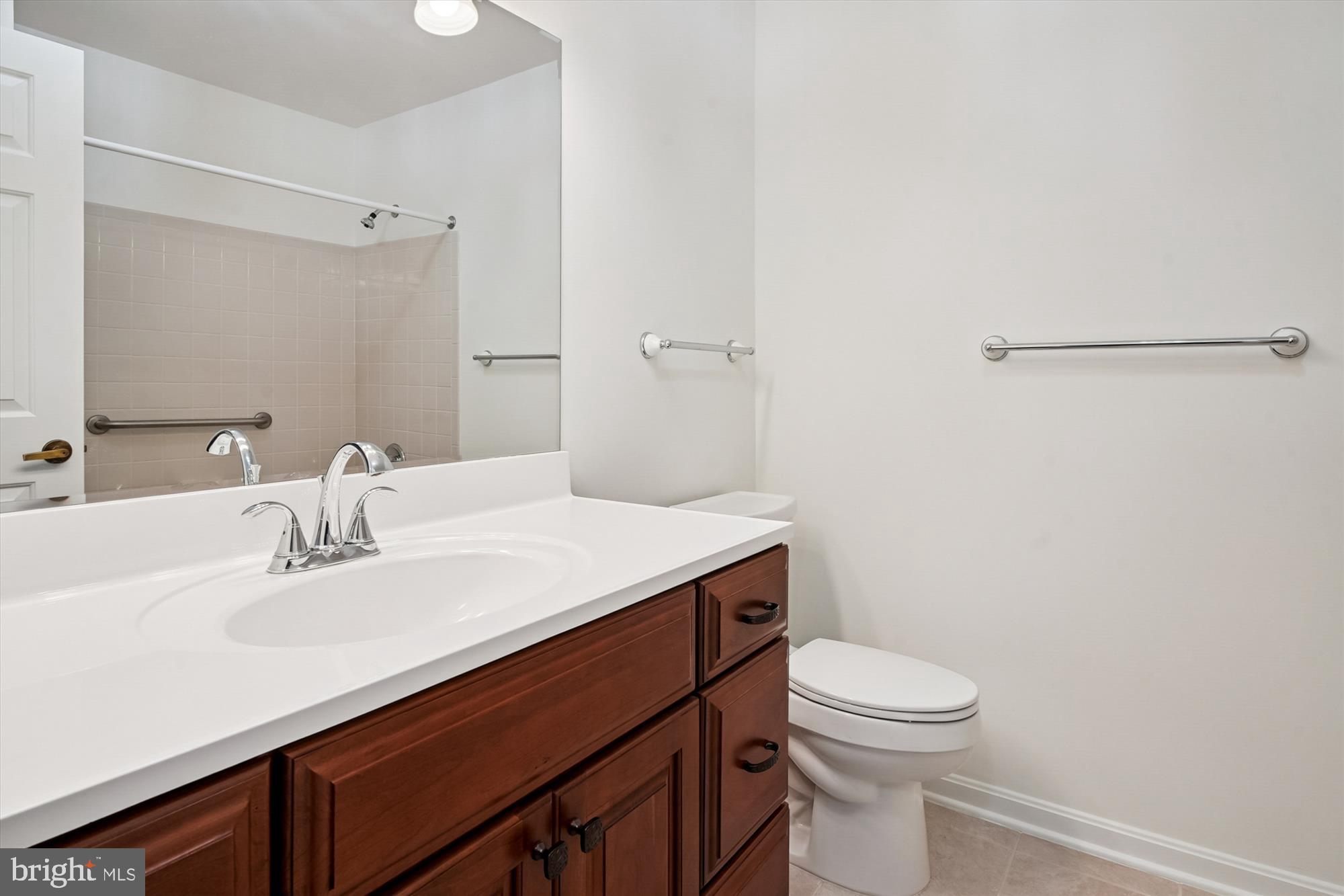 524 Coover Road Annapolis, MD 21401 - Photo 37 of 67 a bathroom with a sink a toilet and shower