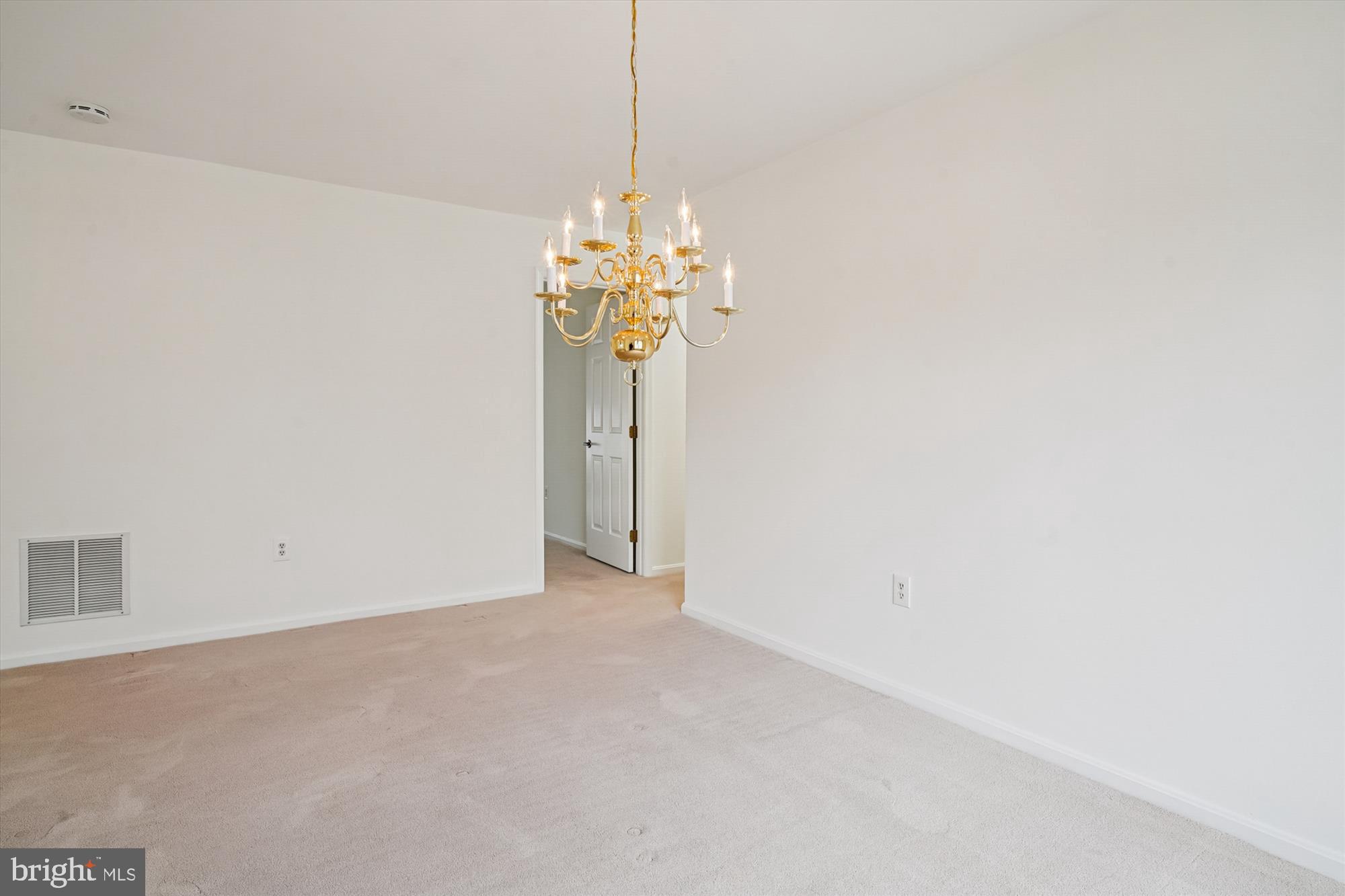 524 Coover Road Annapolis, MD 21401 - Photo 10 of 67 a view of a chandelier fan and refrigerator in a room