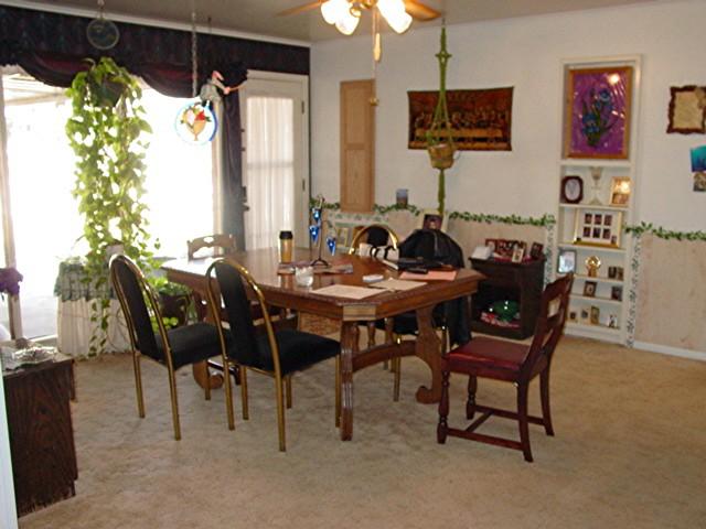 6115 Jameson Road Amarillo, TX 79106 - Photo 2 of 12 a view of a dining room with furniture window and outside view