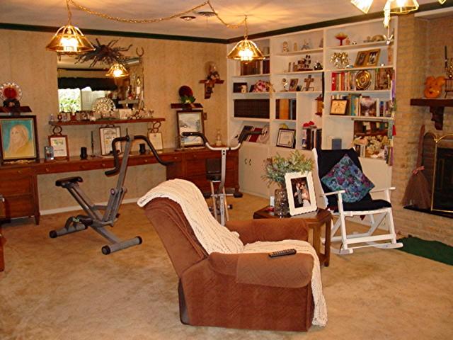 6115 Jameson Road Amarillo, TX 79106 - Photo 5 of 12 a room with gym equipment and a mirror