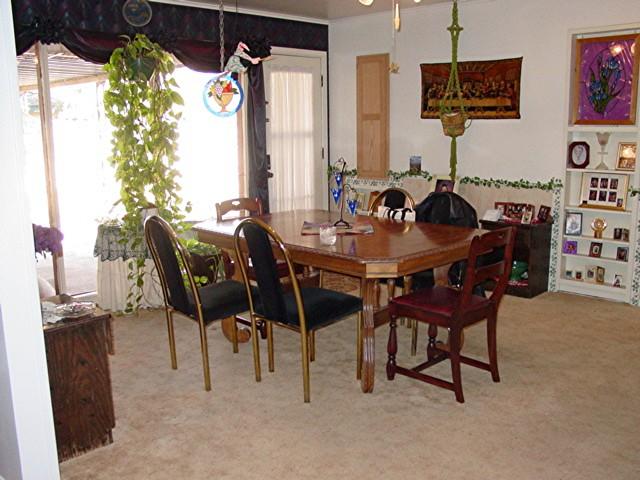 6115 Jameson Road Amarillo, TX 79106 - Photo 10 of 12 a view of a dining room with furniture and chandelier