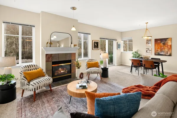 a outdoor living room with furniture and a fireplace