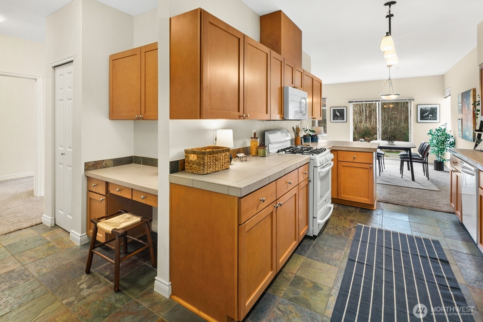 17432 Bothell Way Northeast, Unit B108 Bothell, WA 98011 - Photo 14 of 40 a kitchen with a sink stove and cabinets