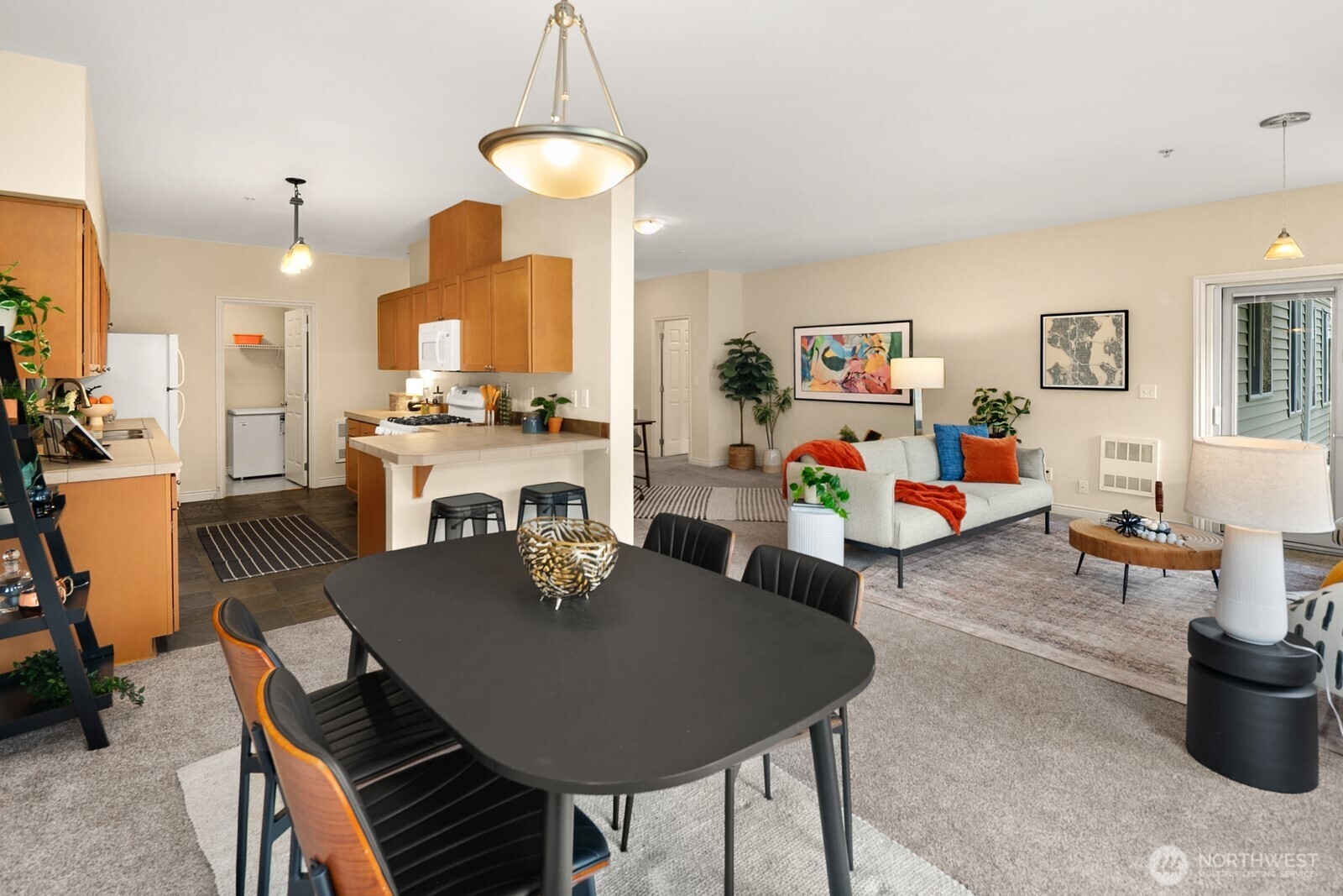 17432 Bothell Way Northeast, Unit B108 Bothell, WA 98011 - Photo 15 of 40 a living room with furniture a table and a chandelier