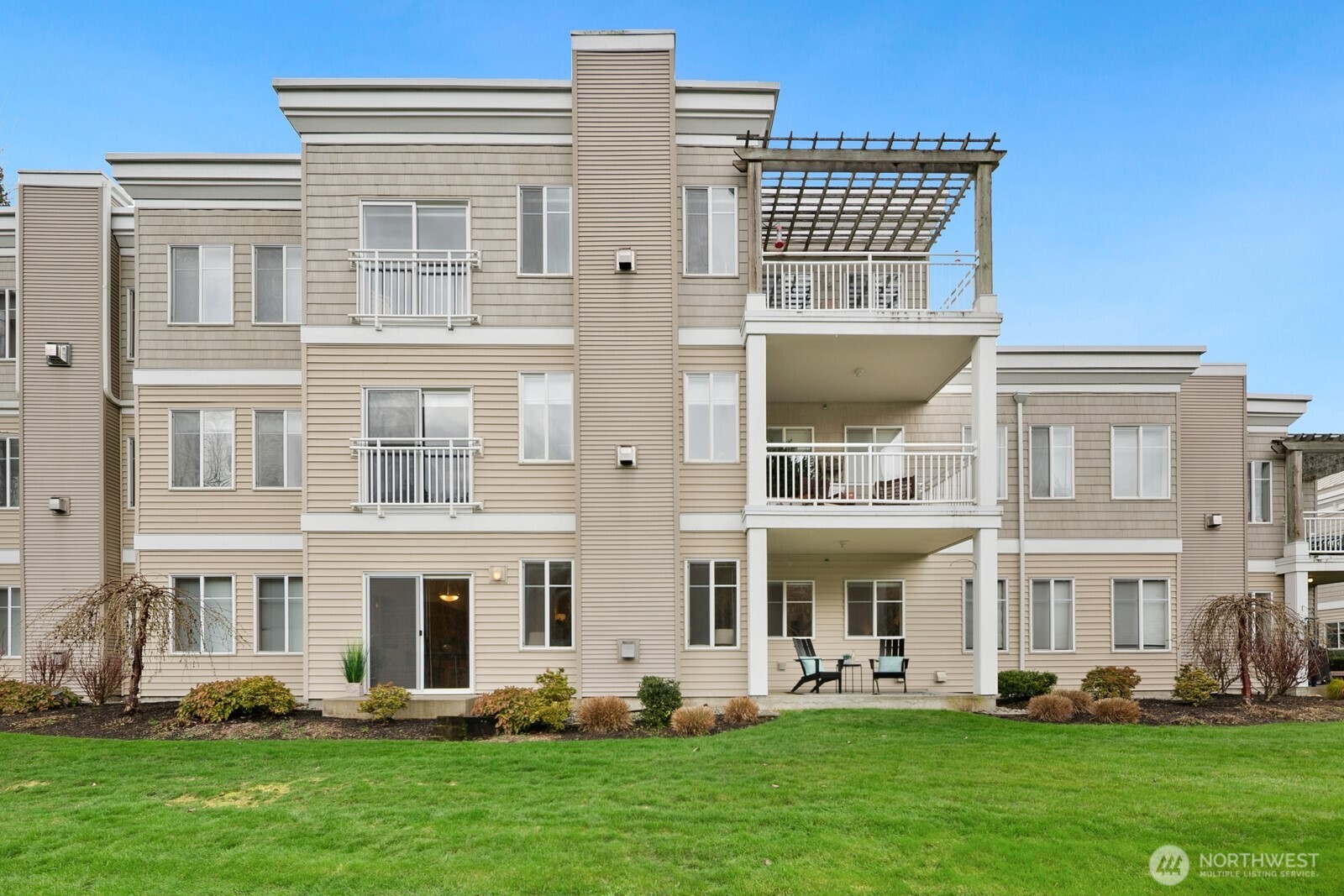 17432 Bothell Way Northeast, Unit B108 Bothell, WA 98011 - Photo 2 of 40 a front view of a building with a yard