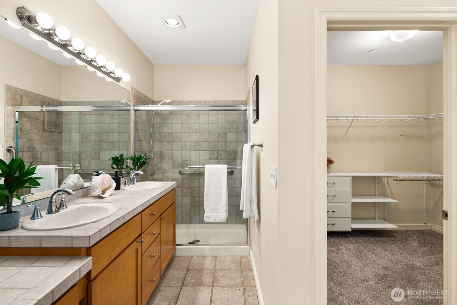 17432 Bothell Way Northeast, Unit B108 Bothell, WA 98011 - Photo 23 of 40 a bathroom with a sink a toilet and shower