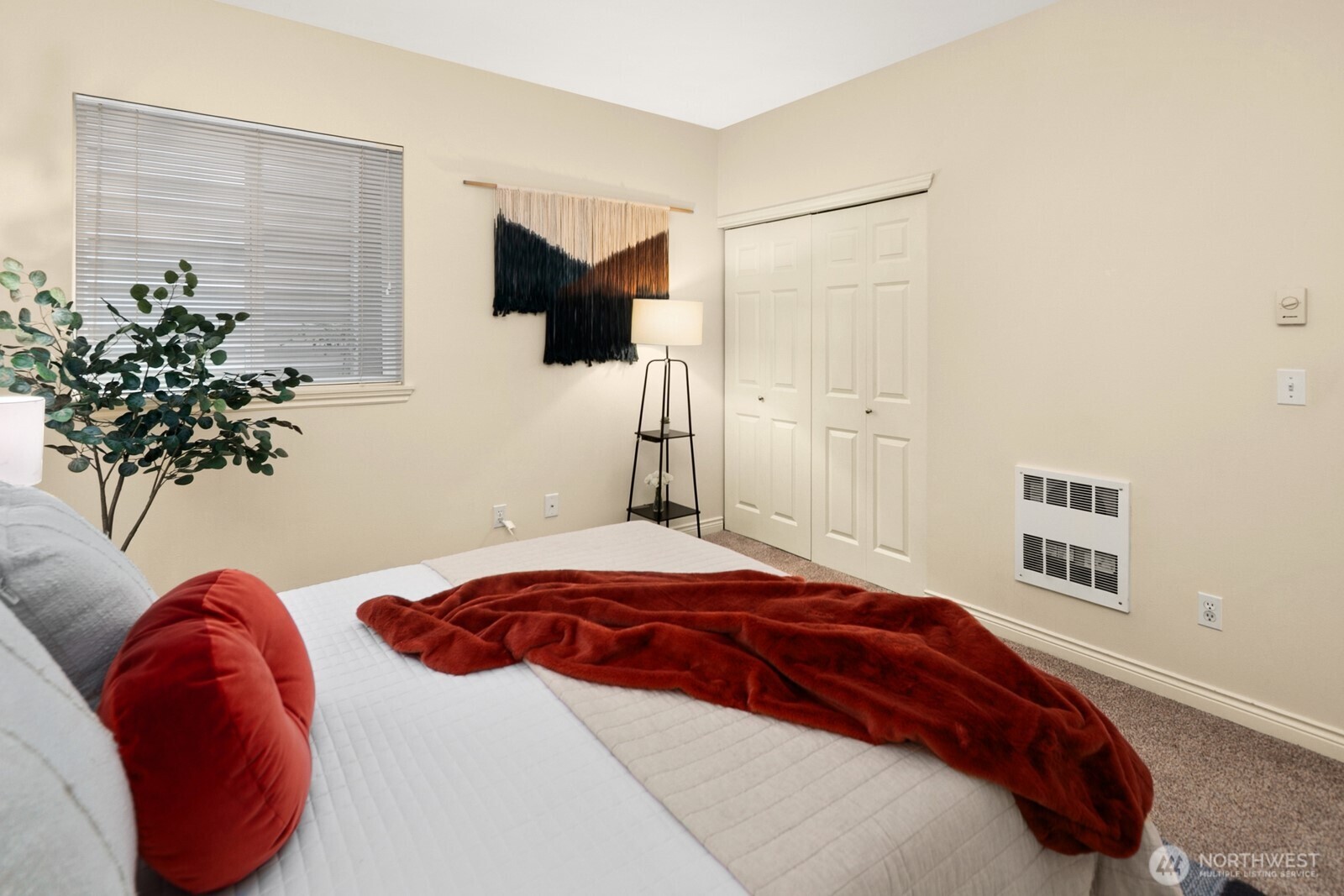 17432 Bothell Way Northeast, Unit B108 Bothell, WA 98011 - Photo 26 of 40 a bedroom with a bed and a potted plant