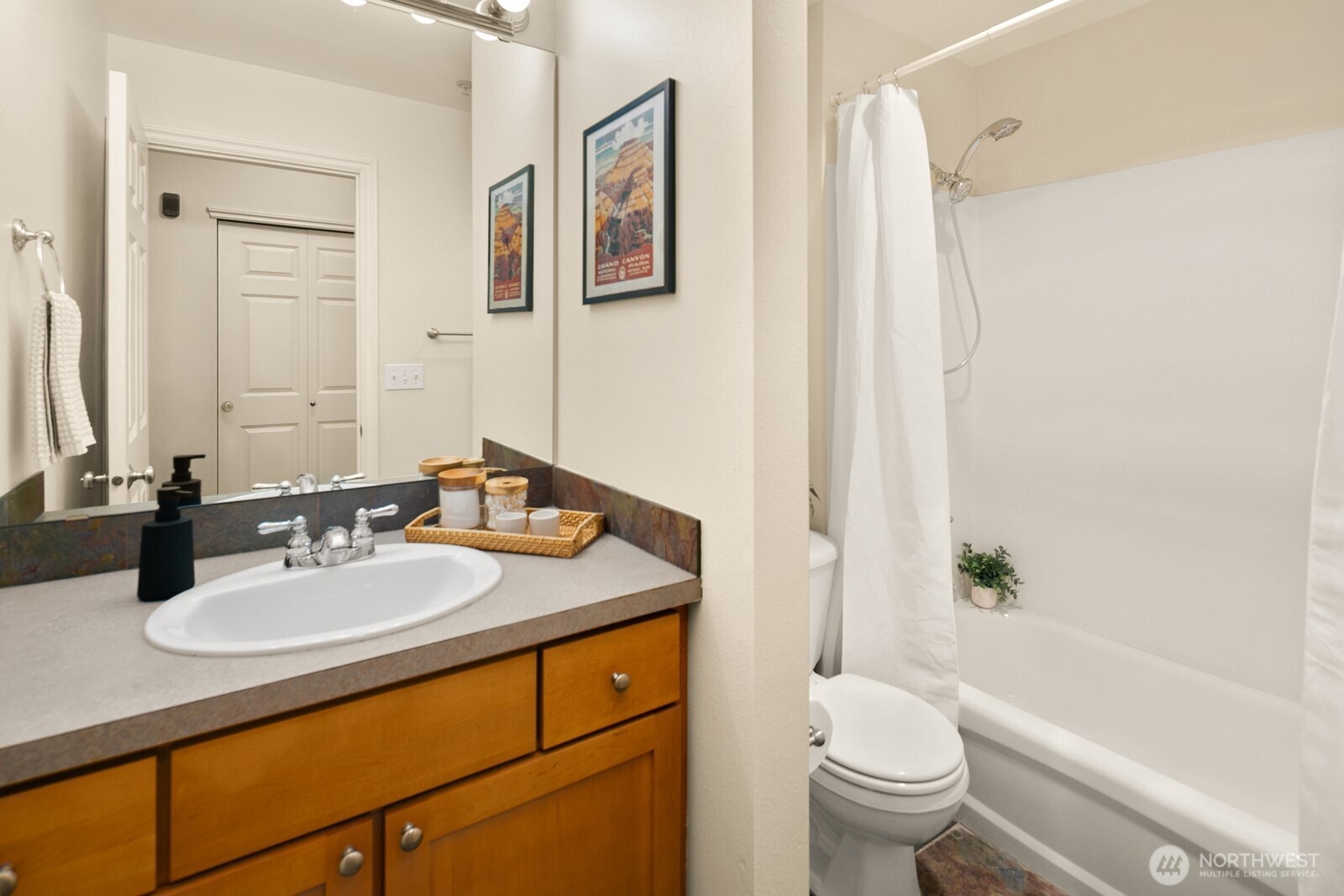 17432 Bothell Way Northeast, Unit B108 Bothell, WA 98011 - Photo 27 of 40 a bathroom with a sink a toilet and shower
