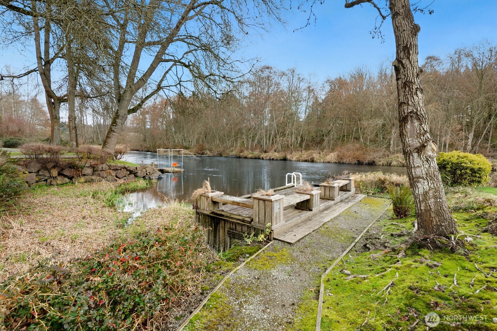 17432 Bothell Way Northeast, Unit B108 Bothell, WA 98011 - Photo 33 of 40 a view of a lake with couches and wooden fence