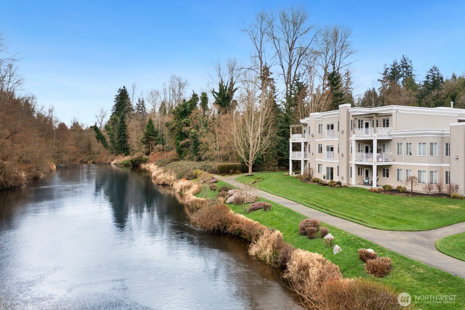 17432 Bothell Way Northeast, Unit B108 Bothell, WA 98011 - Photo 40 of 40 a view of a lake with a yard and large trees