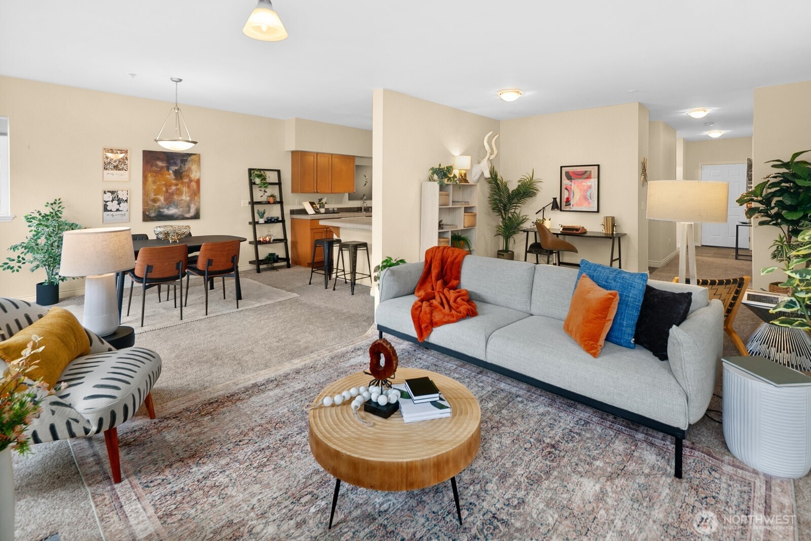 17432 Bothell Way Northeast, Unit B108 Bothell, WA 98011 - Photo 4 of 40 a living room with furniture and a dining table