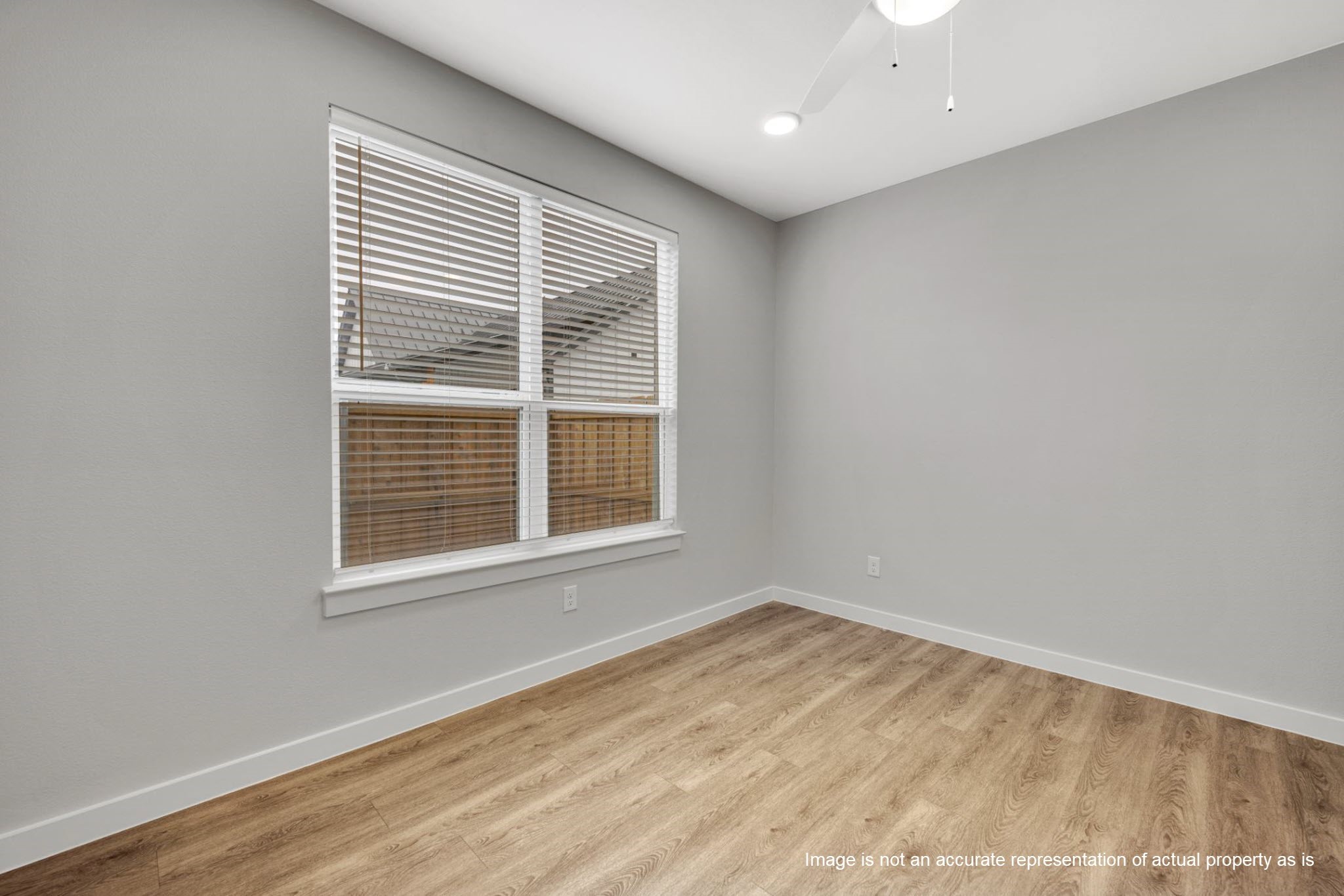 2410 Eaton Street Fort Worth, TX 76108 - Photo 5 of 33 an empty room with wooden floor and windows