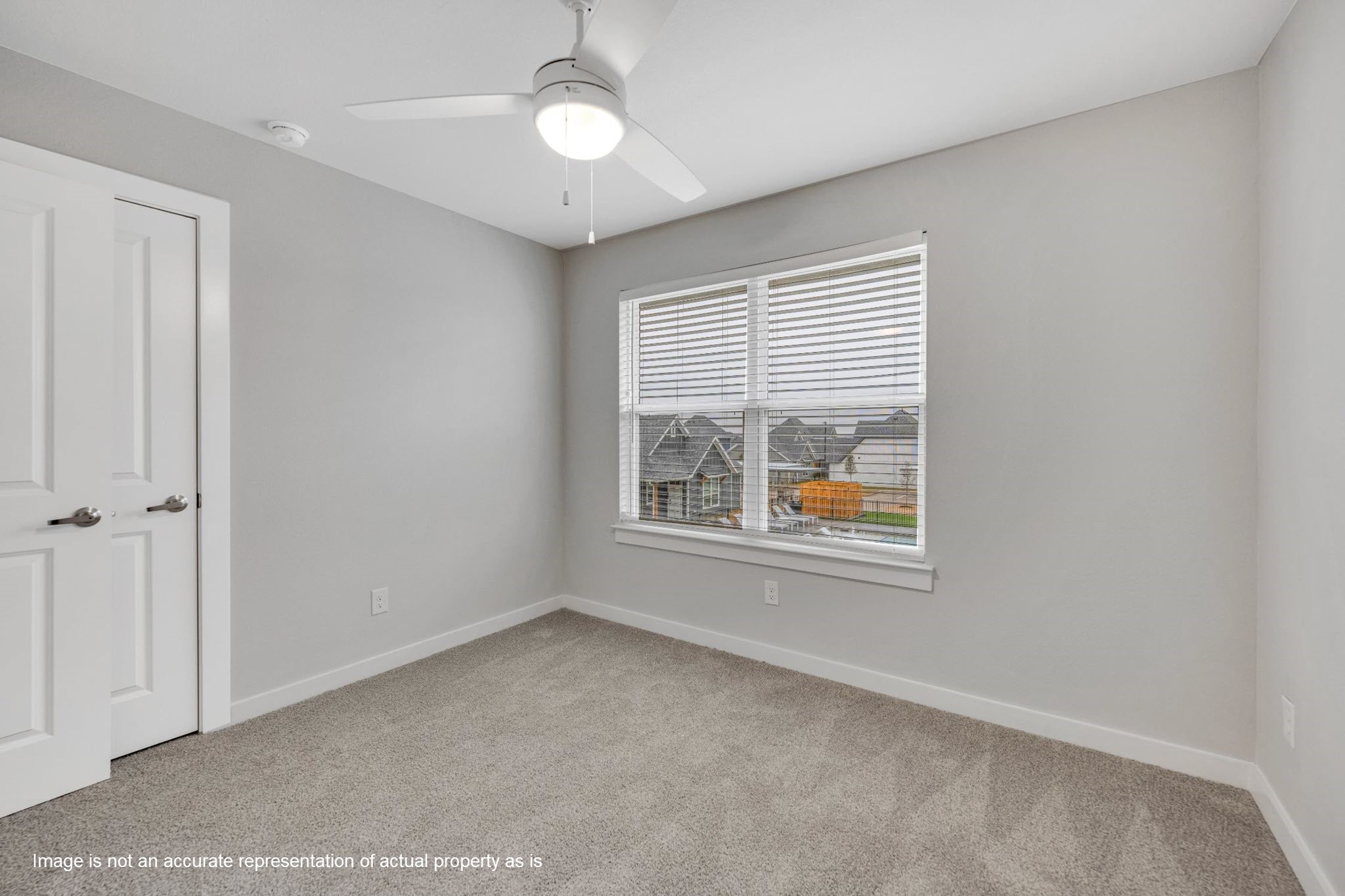 2410 Eaton Street Fort Worth, TX 76108 - Photo 10 of 33 an empty room with a window and doors
