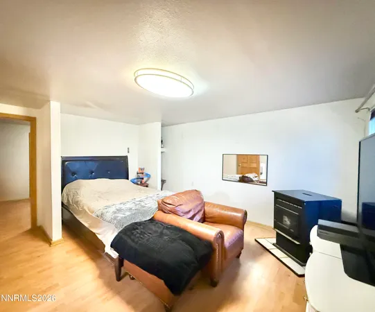 a bedroom with a bed and couch