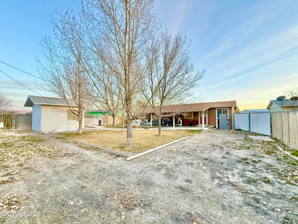 a house with trees in front of it