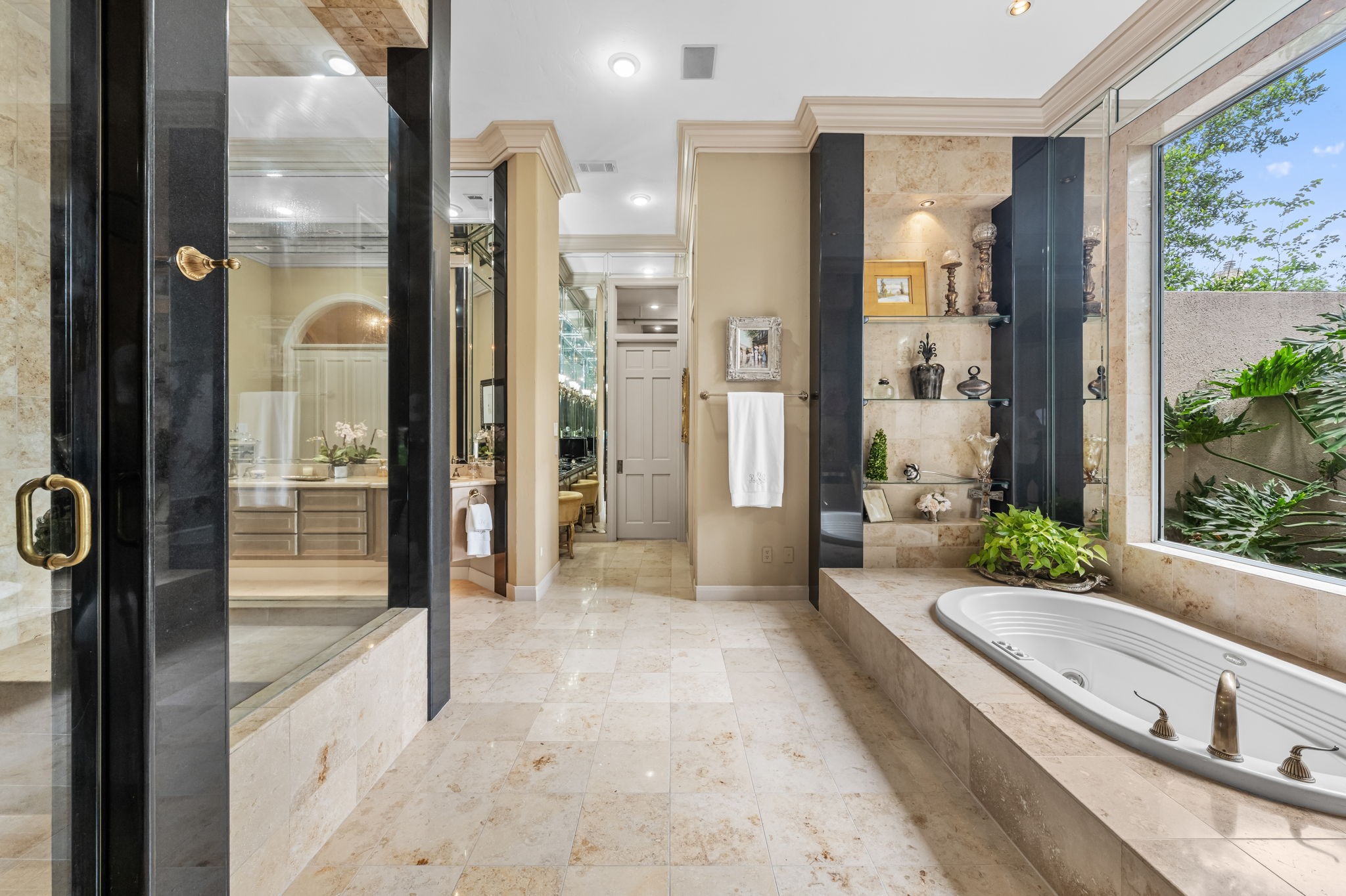 6 Mott Lane Houston, TX 77024 - Photo 21 of 50 Expansive walk-in shower and elegant finishes throughout with abundant natural light create a spa-like retreat within the home.