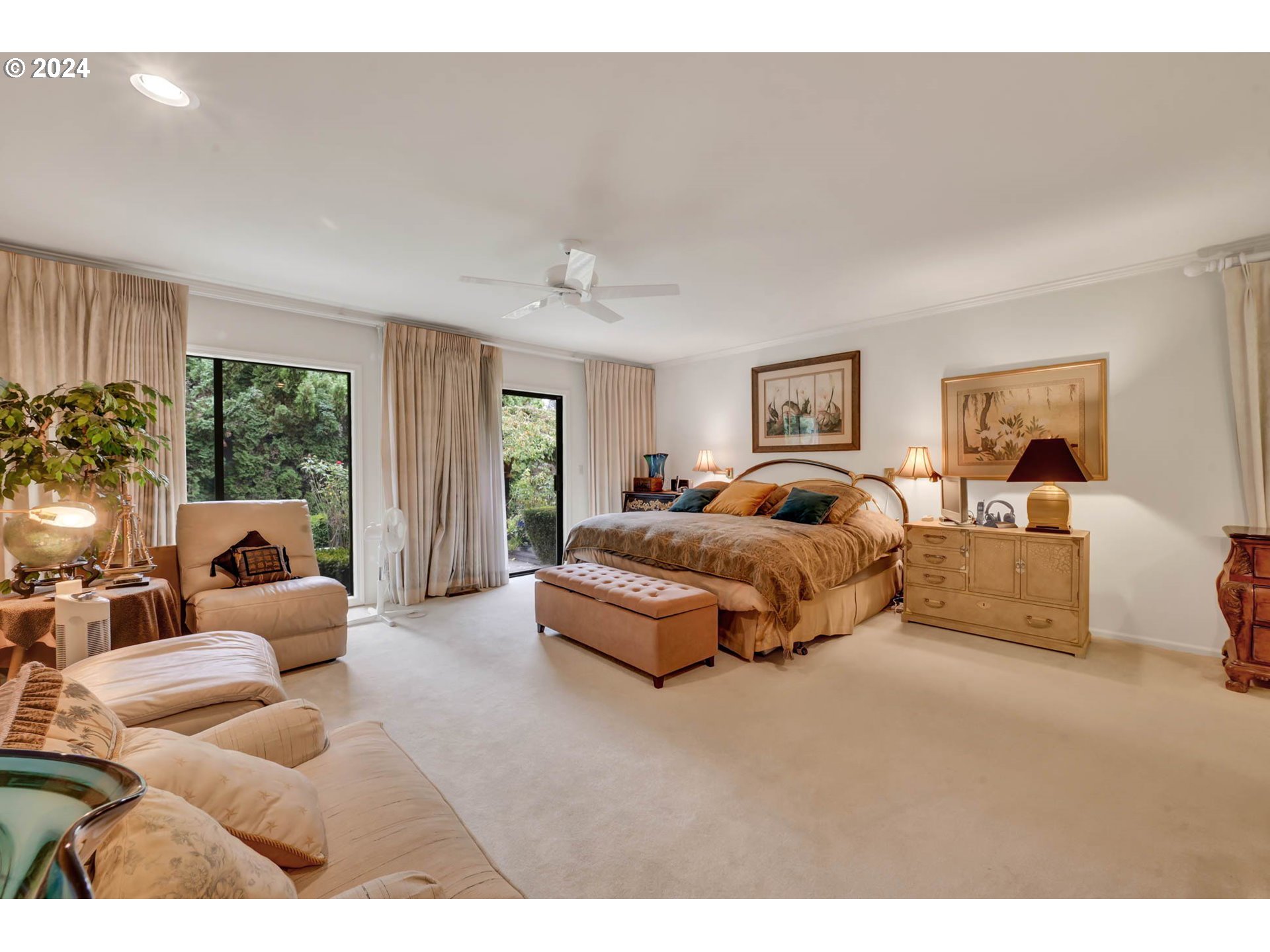 2122 Brookhaven Way Eugene, OR 97401 - Photo 21 of 48 a spacious bedroom with a bed and glass windows