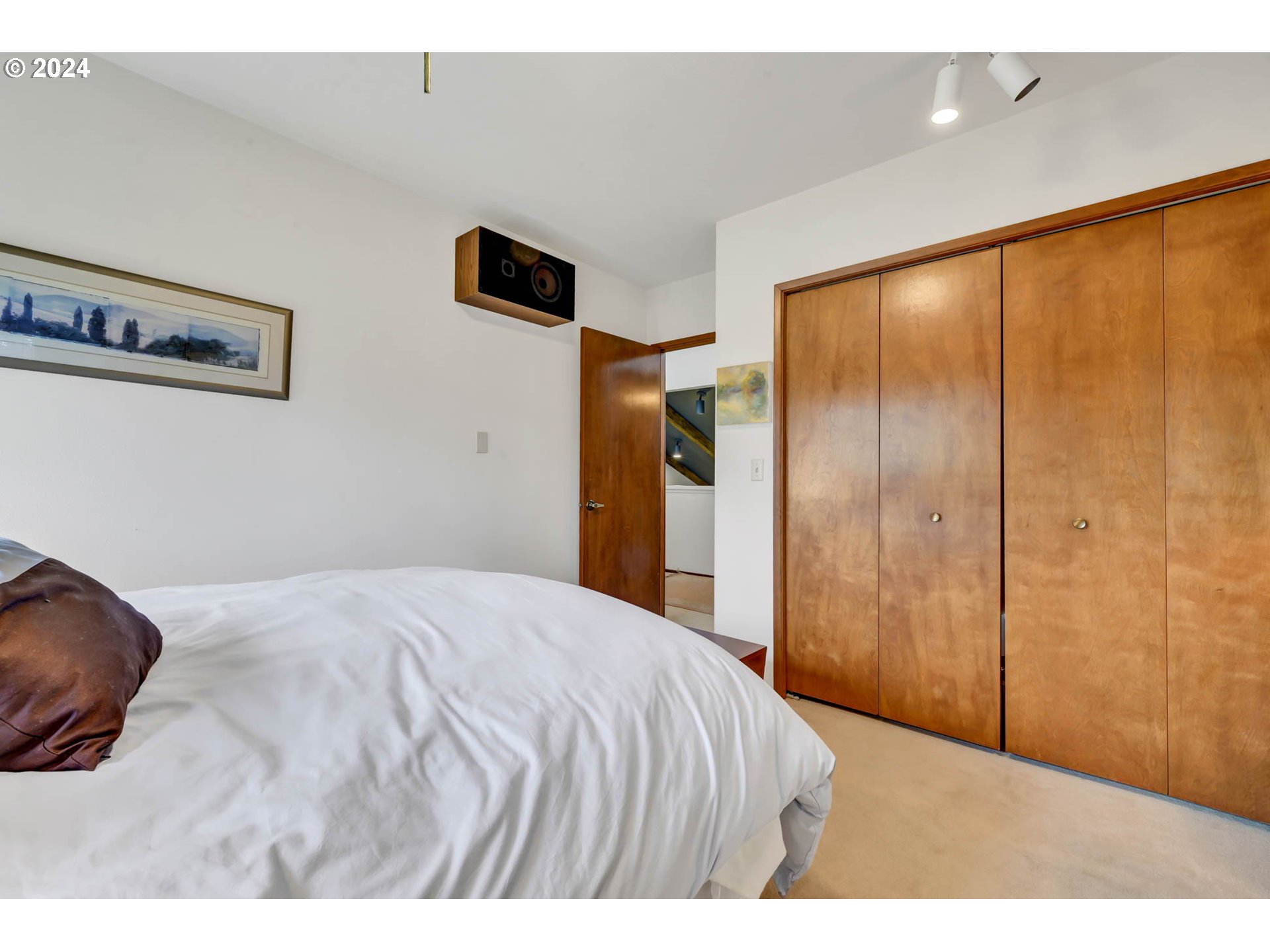 2122 Brookhaven Way Eugene, OR 97401 - Photo 31 of 48 a bedroom with a bed and a painting on the wall