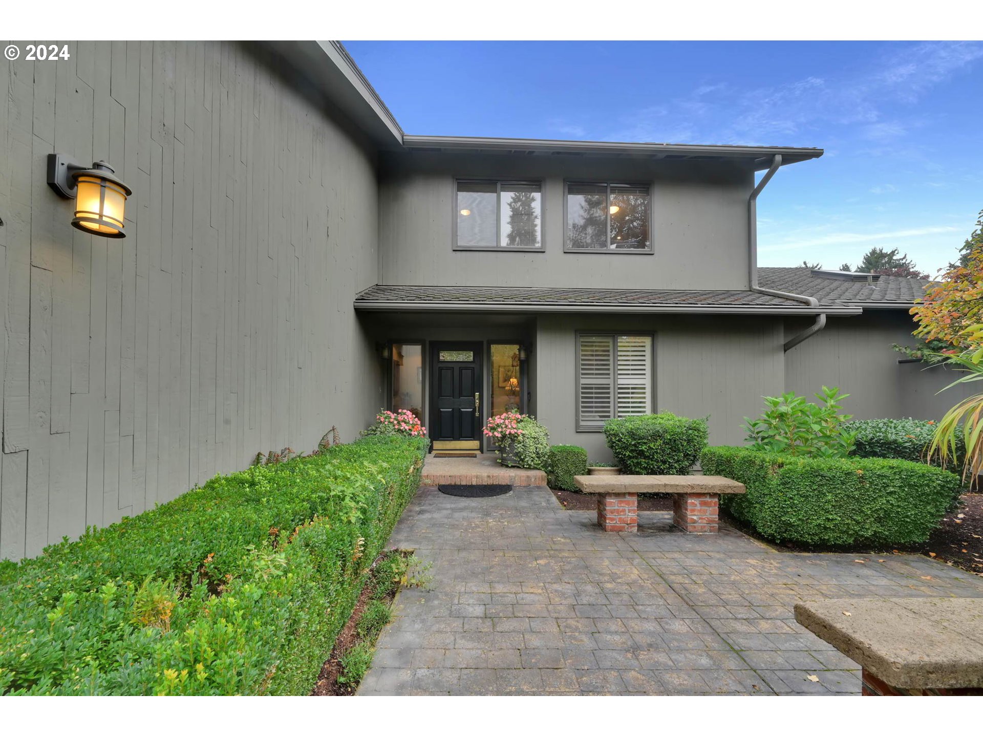 2122 Brookhaven Way Eugene, OR 97401 - Photo 4 of 48 a front view of a house with swing plants and bench