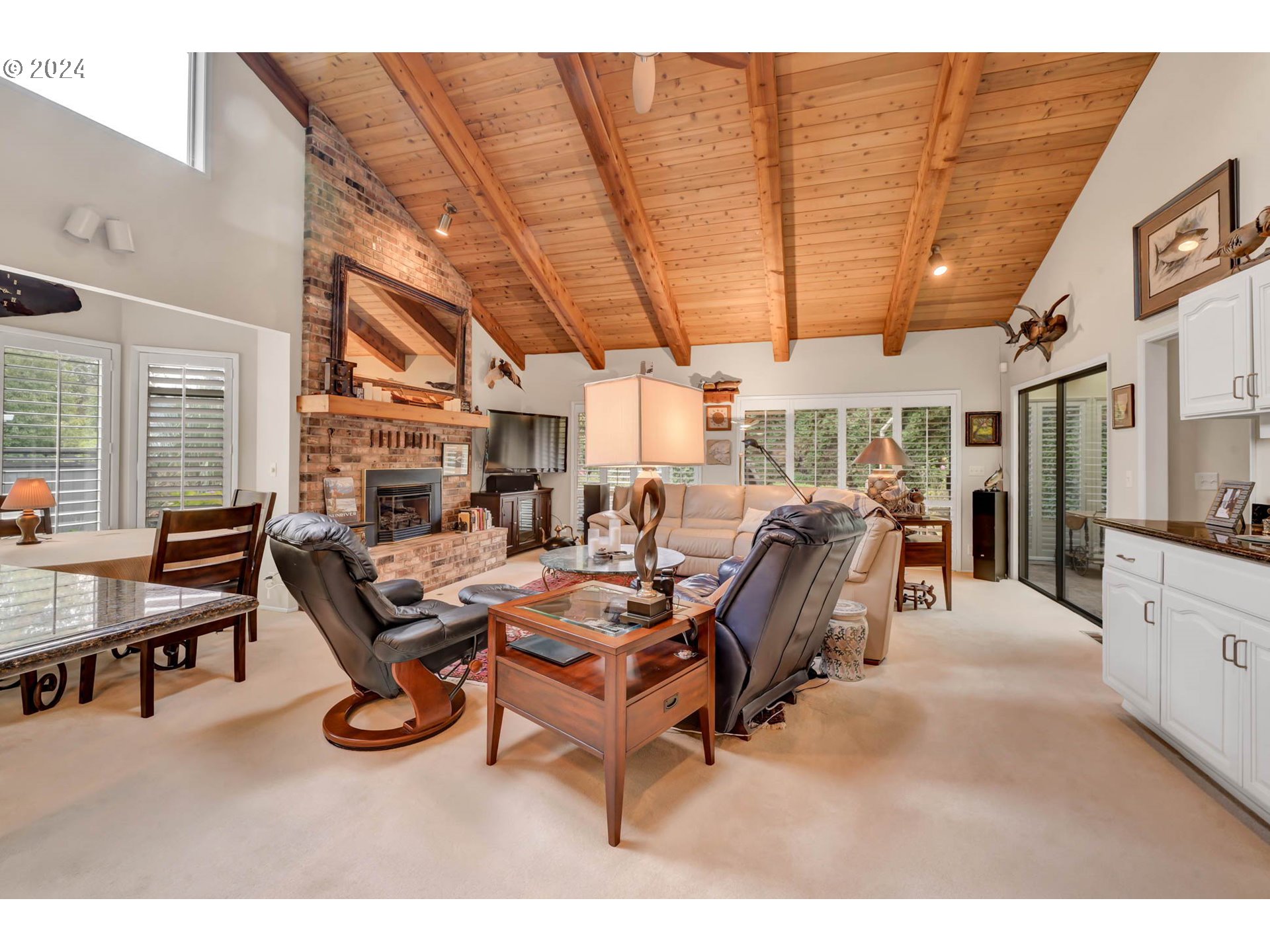 2122 Brookhaven Way Eugene, OR 97401 - Photo 5 of 48 a living room with furniture a flat screen tv and a table