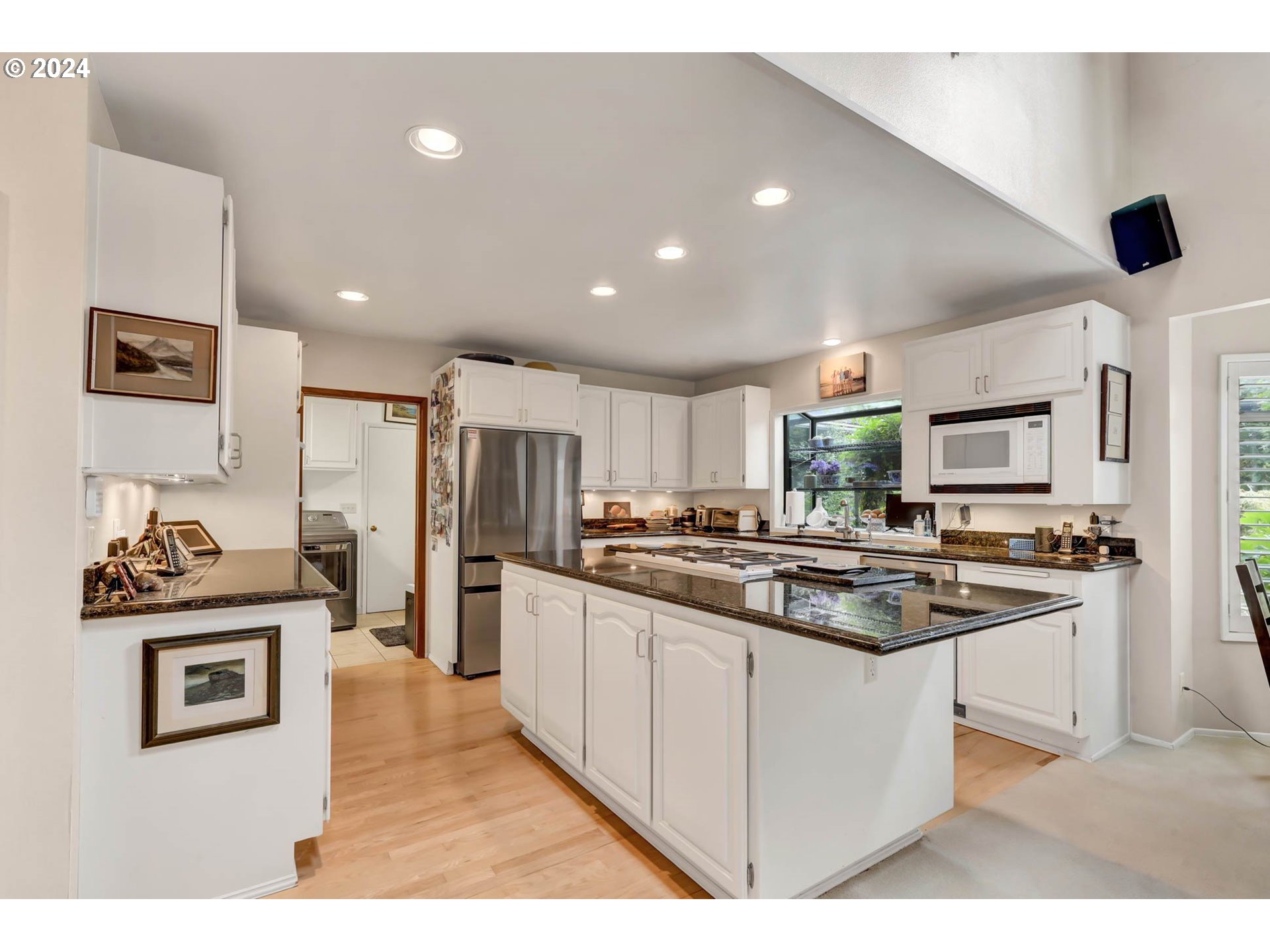 2122 Brookhaven Way Eugene, OR 97401 - Photo 7 of 48 a kitchen with stainless steel appliances granite countertop a stove top oven a sink and a refrigerator
