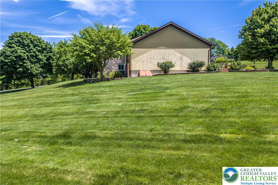 947 Tamenend Road Bath, PA 18014 - Photo 47 of 61 A verdant hillside property, offering ample space and serene outdoor living.