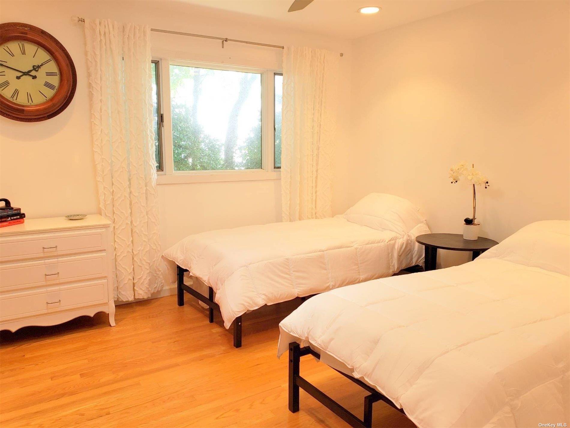 11 Beach Road Riverhead, NY 11947 - Photo 24 of 34 a bedroom with 2 bed and a window