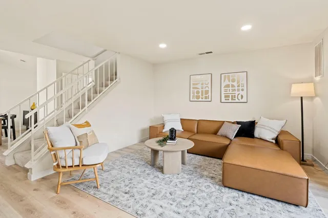 a living room with furniture and a table