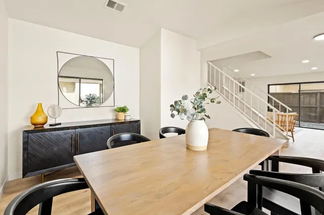 a kitchen with a table and chairs