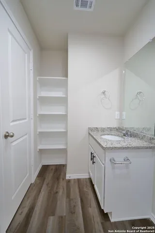 a kitchen with a stove and cabinets