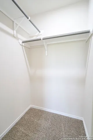 a view of an empty walk in closet