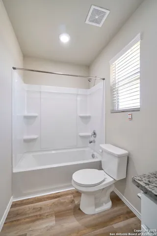 a bathroom with a toilet a sink and a bathtub
