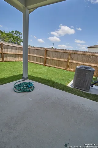 a view of a garden with a building in the background