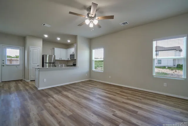 a view of kitchen and windows