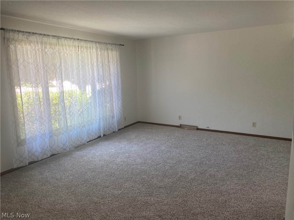 13005 Milo Road Cleveland, OH 44125 - Photo 23 of 33 Empty room with carpet