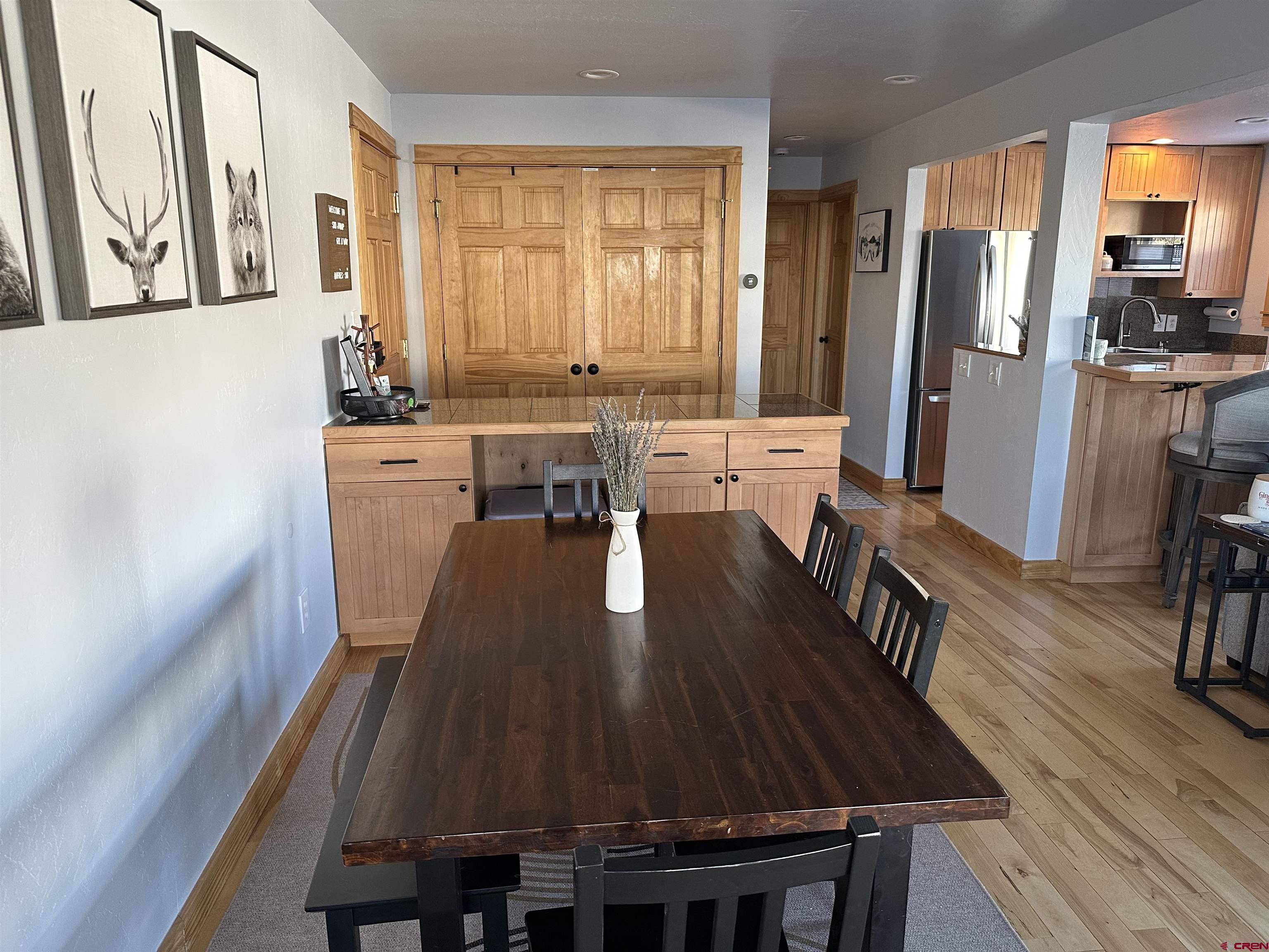 755 Gothic Road, Unit 2 Crested Butte, CO 81225 - Photo 11 of 36 a view of a dining room with furniture window and wooden floor