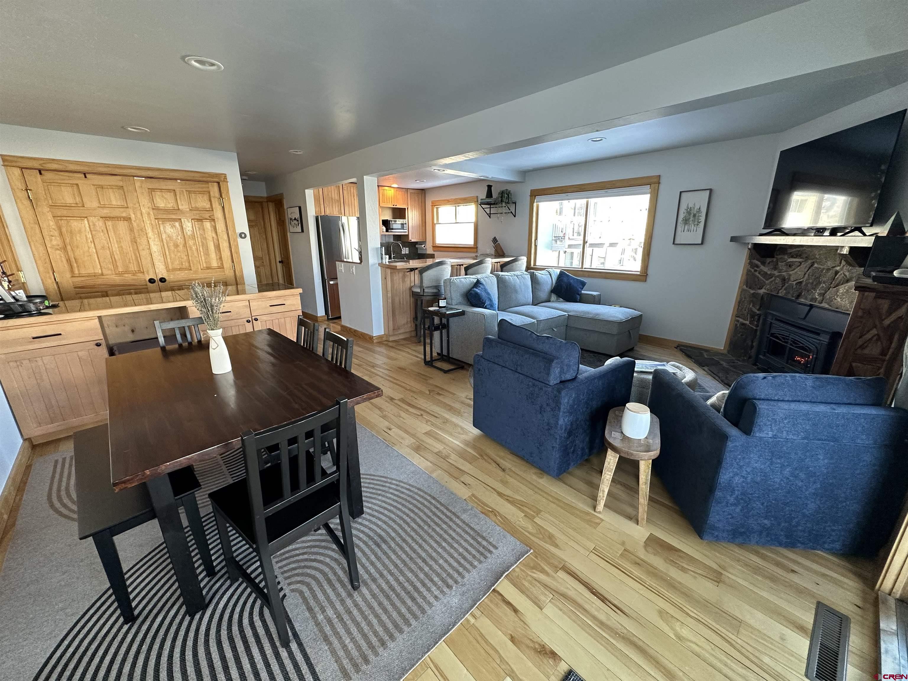 755 Gothic Road, Unit 2 Crested Butte, CO 81225 - Photo 11 of 36 a living room with furniture and a flat screen tv