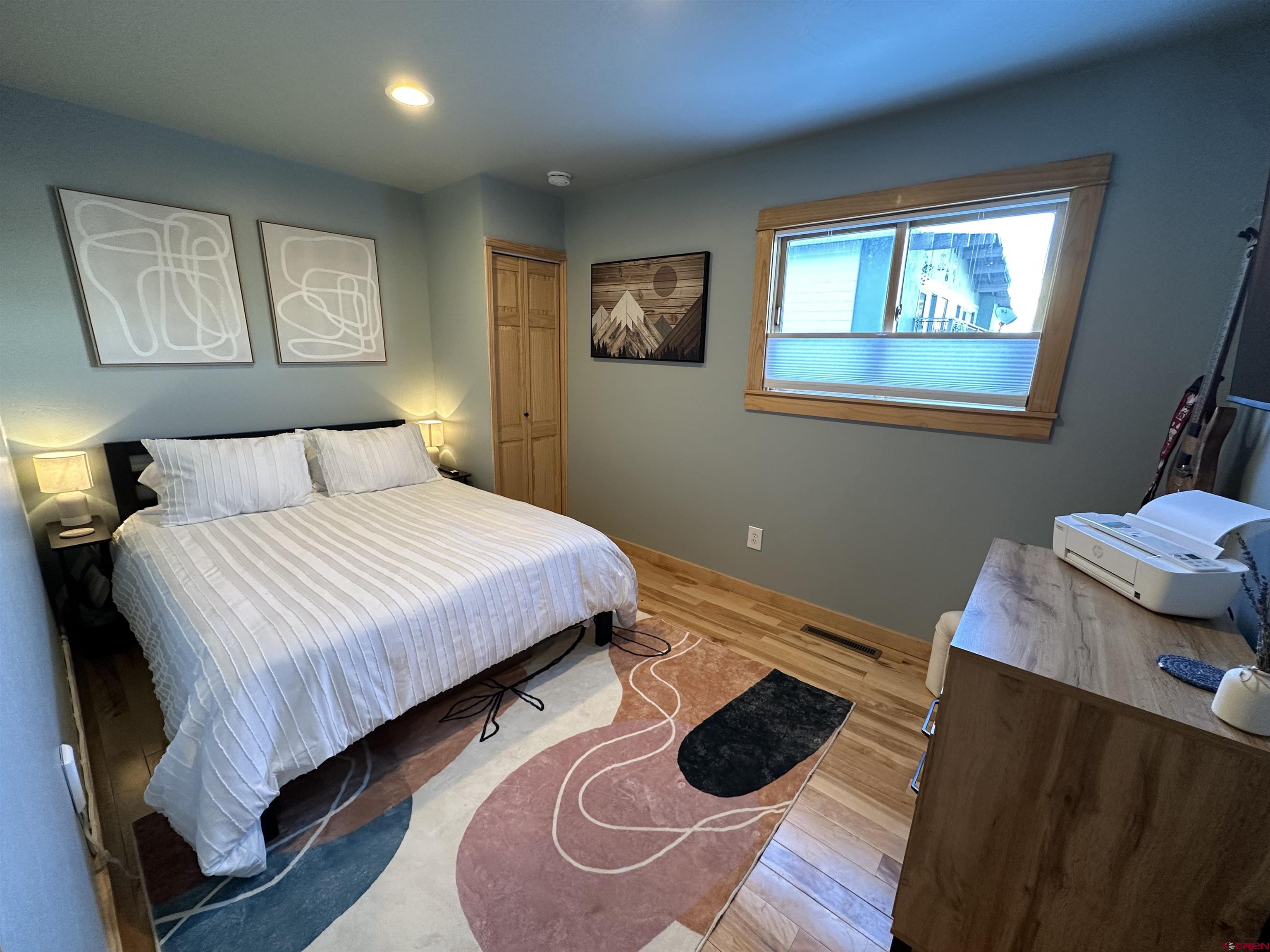 755 Gothic Road, Unit 2 Crested Butte, CO 81225 - Photo 17 of 36 a bedroom with a bed and a window