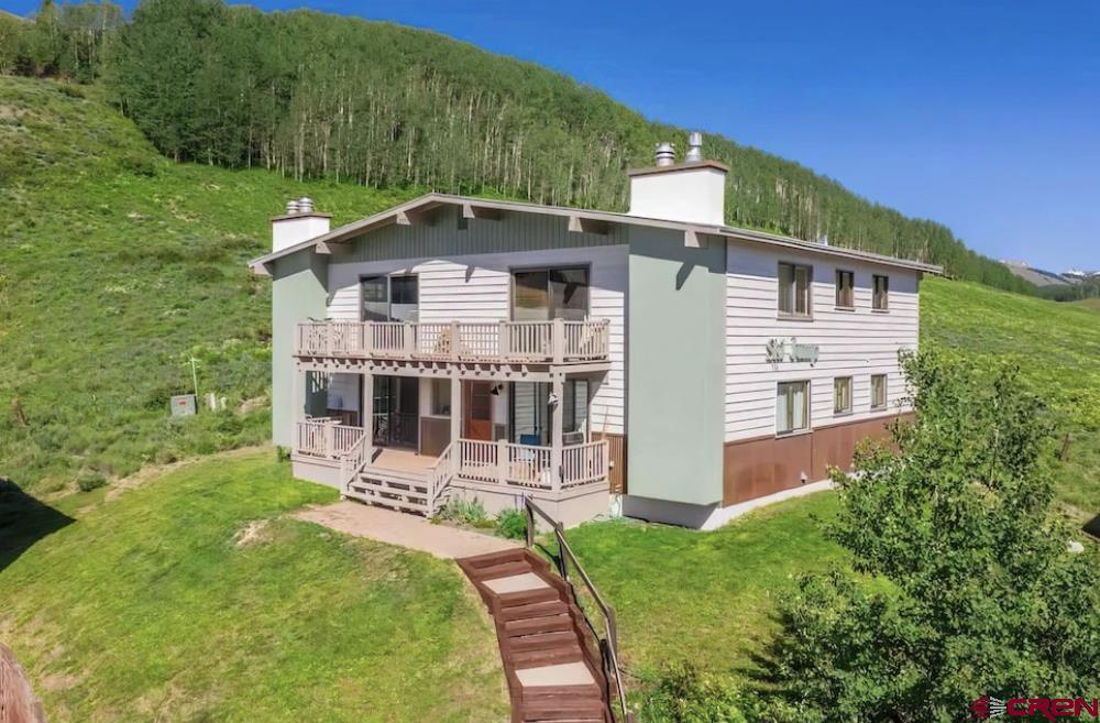755 Gothic Road, Unit 2 Crested Butte, CO 81225 - Photo 36 of 36 front view of a house with a yard