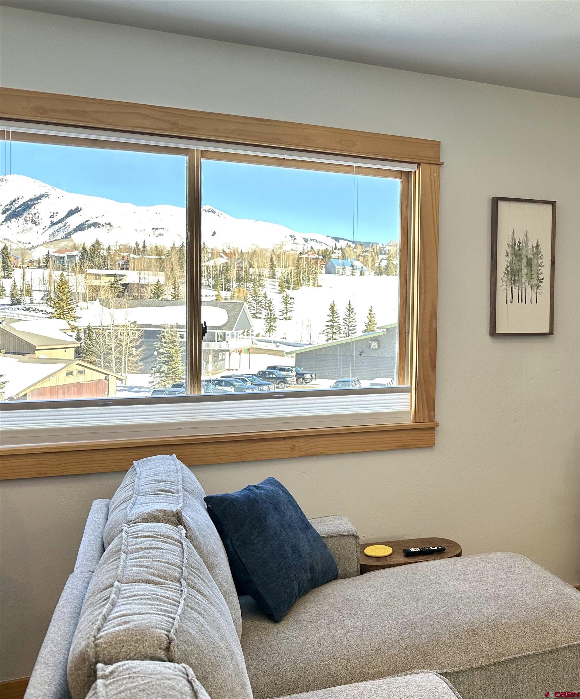 755 Gothic Road, Unit 2 Crested Butte, CO 81225 - Photo 7 of 36 a bedroom with a bed and a large window