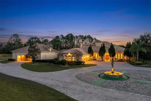 a swimming pool in middle of the green field