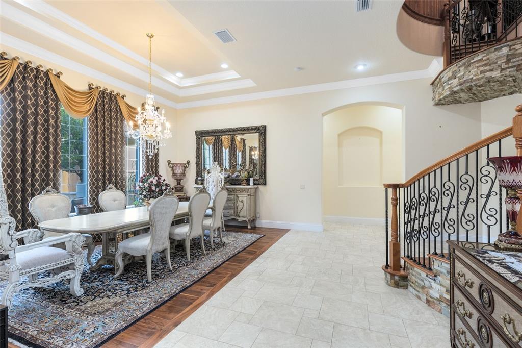 5300 Carson Street St. Cloud, FL 34771 - Photo 11 of 59 a living room with furniture a rug and a chandelier