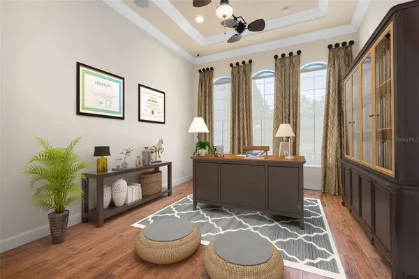 a kitchen with stainless steel appliances kitchen island granite countertop a dining table chairs and white cabinets