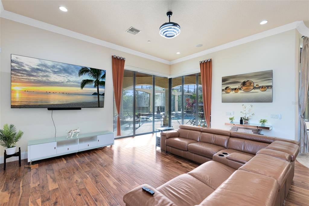 5300 Carson Street St. Cloud, FL 34771 - Photo 20 of 59 a living room with furniture and a flat screen tv