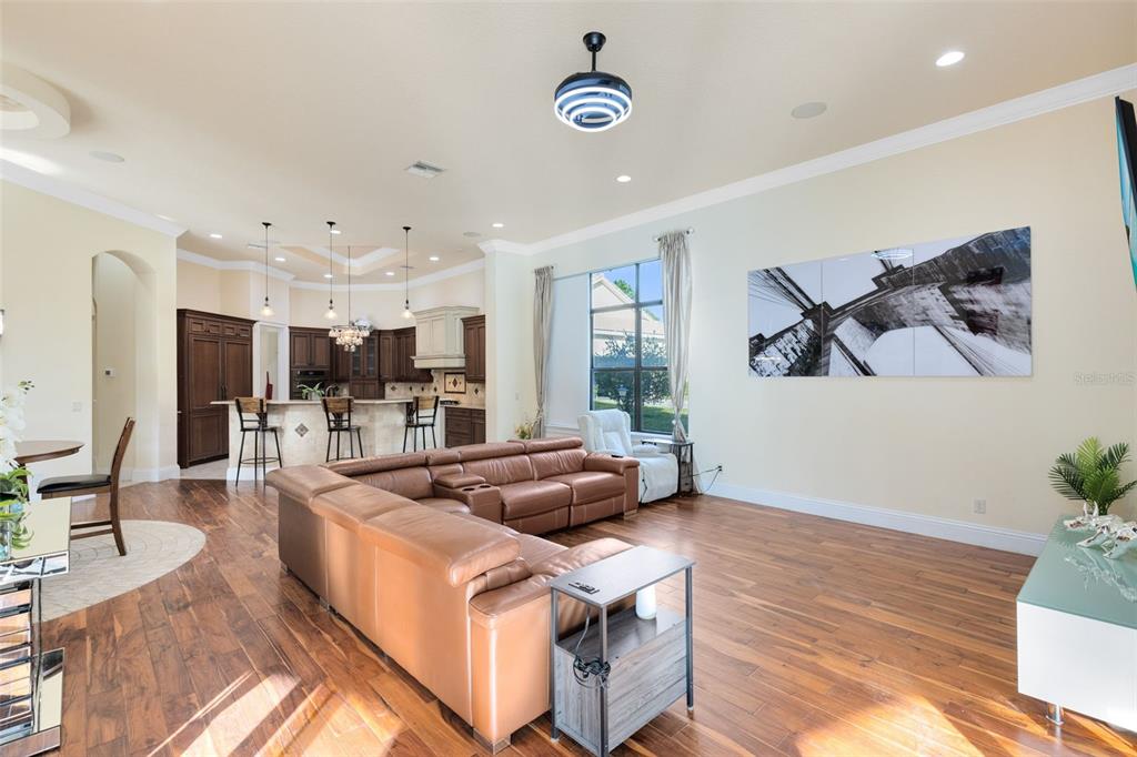 5300 Carson Street St. Cloud, FL 34771 - Photo 21 of 59 a living room with furniture kitchen view and a large window