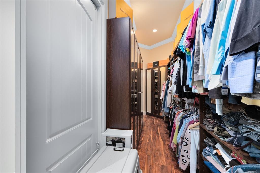 5300 Carson Street St. Cloud, FL 34771 - Photo 25 of 59 a view of walk in closet with clothes and shoes